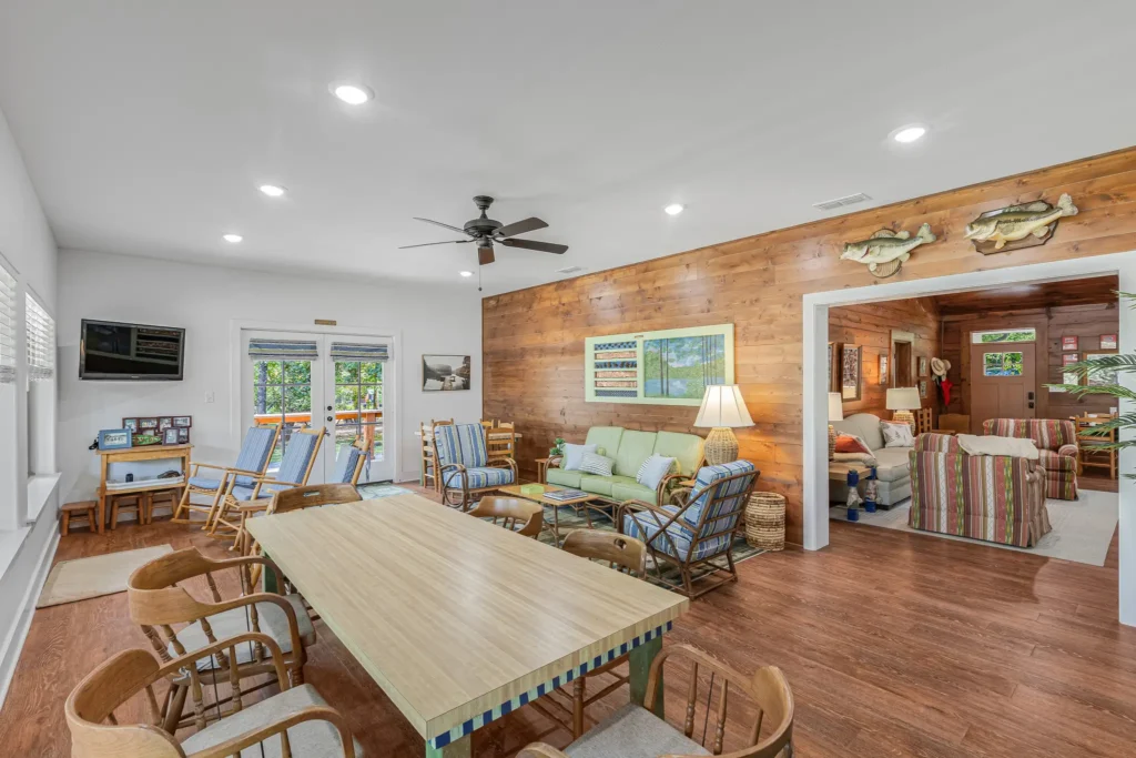 Dining and living area lined with windows