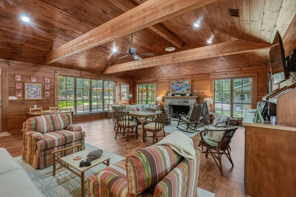 Family room with pine walls and a beamed pine ceiling